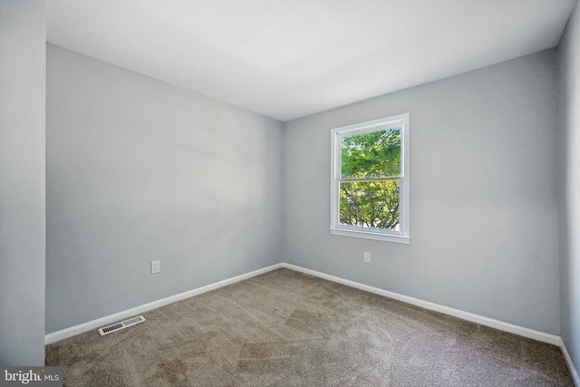 8591 King Carter St, Manassas, VA 20110 - carpeted empty room featuring baseboards