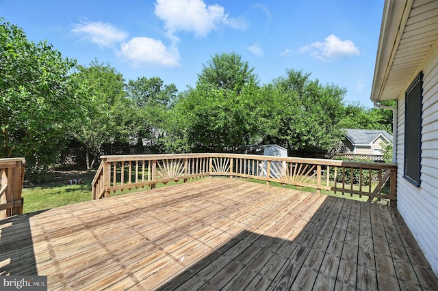 8591 King Carter St, Manassas, VA 20110 - wooden deck with a storage unit, a fenced backyard, and view of scattered trees