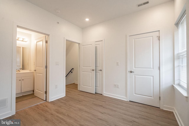 1107 S 27th St, Philadelphia, PA 19146 - unfurnished bedroom with light wood finished floors, ensuite bath, and recessed lighting