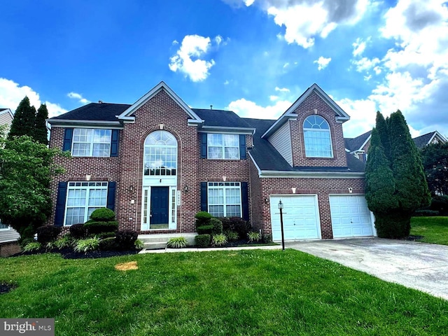 10005 Erion Ct, Bowie, MD 20721 - colonial house with concrete driveway, a garage, a front lawn, and brick siding
