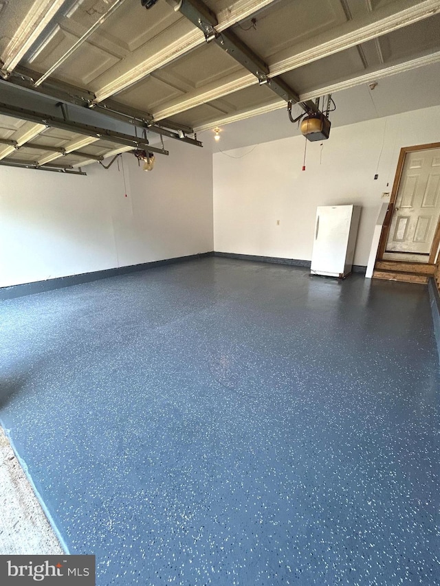 10005 Erion Ct, Bowie, MD 20721 - garage with freestanding refrigerator and a garage door opener