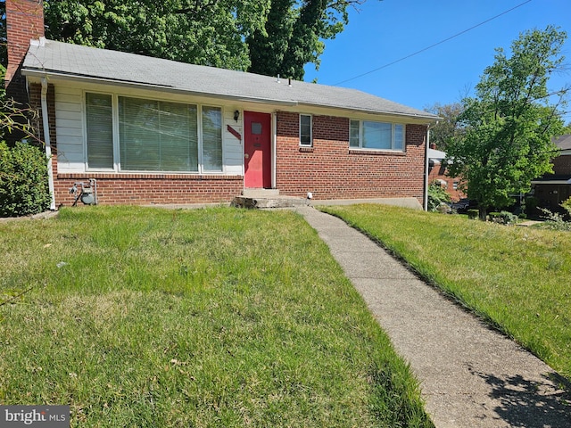 1614 Erskine St, Hyattsville, MD 20783 - view of front of property featuring brick siding, a front lawn, and a chimney
