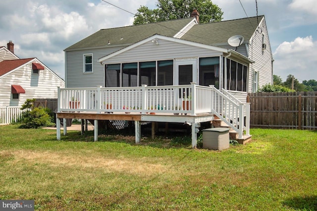 103 David Rd, Wilmington, DE 19804 - rear view of property featuring a sunroom, a fenced backyard, a deck, and a shingled roof