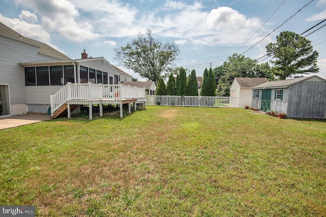 103 David Rd, Wilmington, DE 19804 - view of yard featuring a sunroom, a storage shed, stairway, and a wooden deck