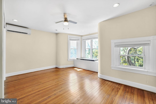 1223 Euclid St NW, Washington, DC 20009 - unfurnished living room with a wall mounted air conditioner, a ceiling fan, light wood finished floors, and recessed lighting