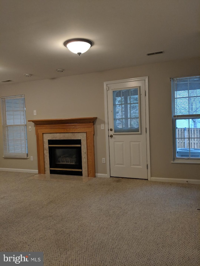 46838 Graham Cove Sq, Sterling, VA 20165 - unfurnished living room featuring carpet flooring and a fireplace with flush hearth