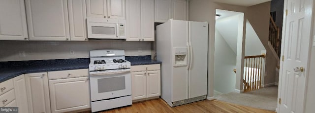 46838 Graham Cove Sq, Sterling, VA 20165 - kitchen featuring white appliances, dark countertops, white cabinetry, and light wood-style floors