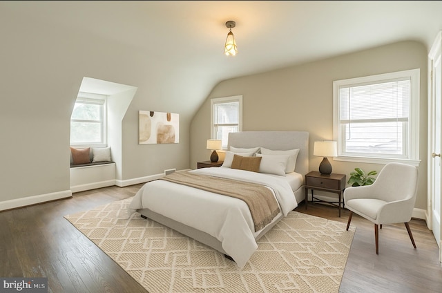 2504 Parkview Rd, Baltimore, MD 21207 - bedroom with multiple windows, light wood-type flooring, and lofted ceiling