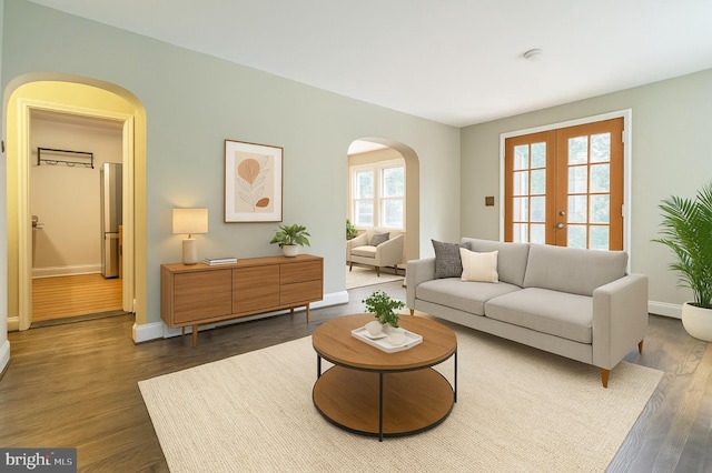 2504 Parkview Rd, Baltimore, MD 21207 - living area featuring arched walkways, french doors, and wood finished floors