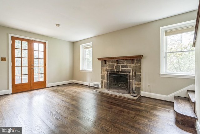 2504 Parkview Rd, Baltimore, MD 21207 - unfurnished living room with wood finished floors, french doors, a fireplace, and stairs
