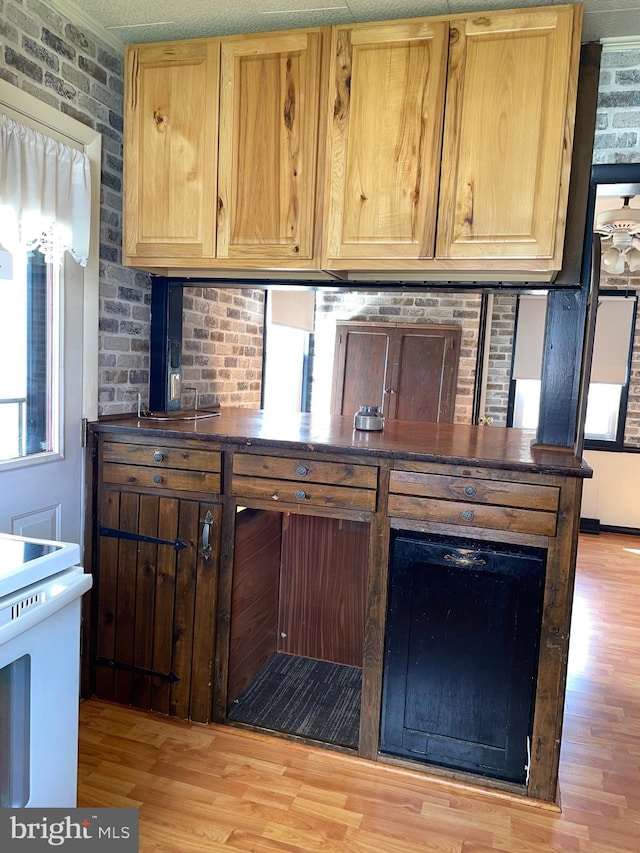 502 S Juniata St, Lewistown, PA 17044 - kitchen with white electric range oven, light wood-type flooring, and dark countertops