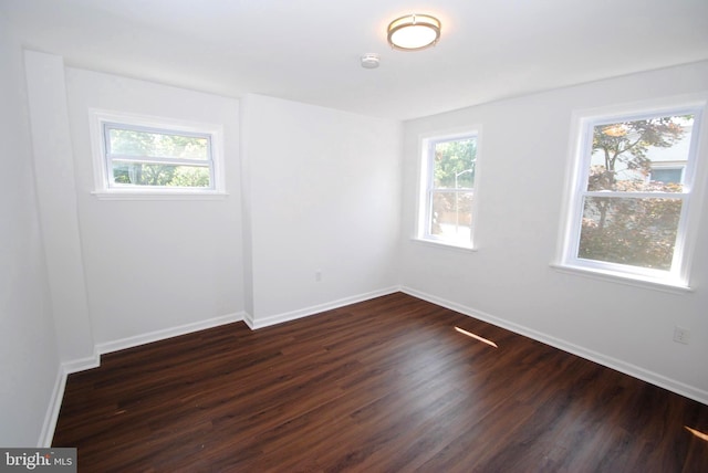 217 Wood St, Burlington, NJ 08016 - spare room with dark wood finished floors and a smoke detector