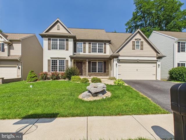 53 Hamlet Cir, Mechanicsburg, PA 17050 - traditional-style home with asphalt driveway, a garage, and a front lawn