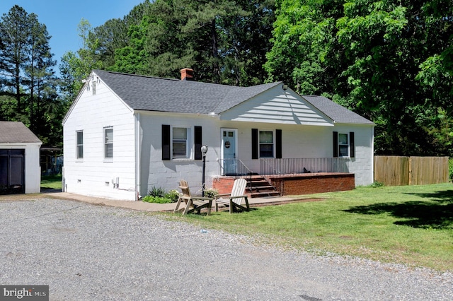 10439 Ashcake Rd, Ashland, VA 23005 - view of front of home with roof with shingles, a porch, and a chimney