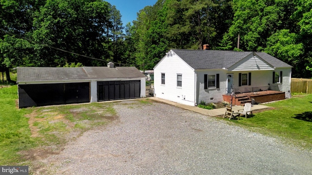 10439 Ashcake Rd, Ashland, VA 23005 - ranch-style home with a detached garage, a shingled roof, a porch, an outdoor structure, and a front yard