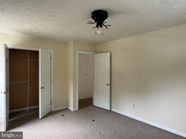 1809 Labrott Ln, Annapolis, MD 21401 - unfurnished bedroom featuring a closet, carpet flooring, and a textured ceiling