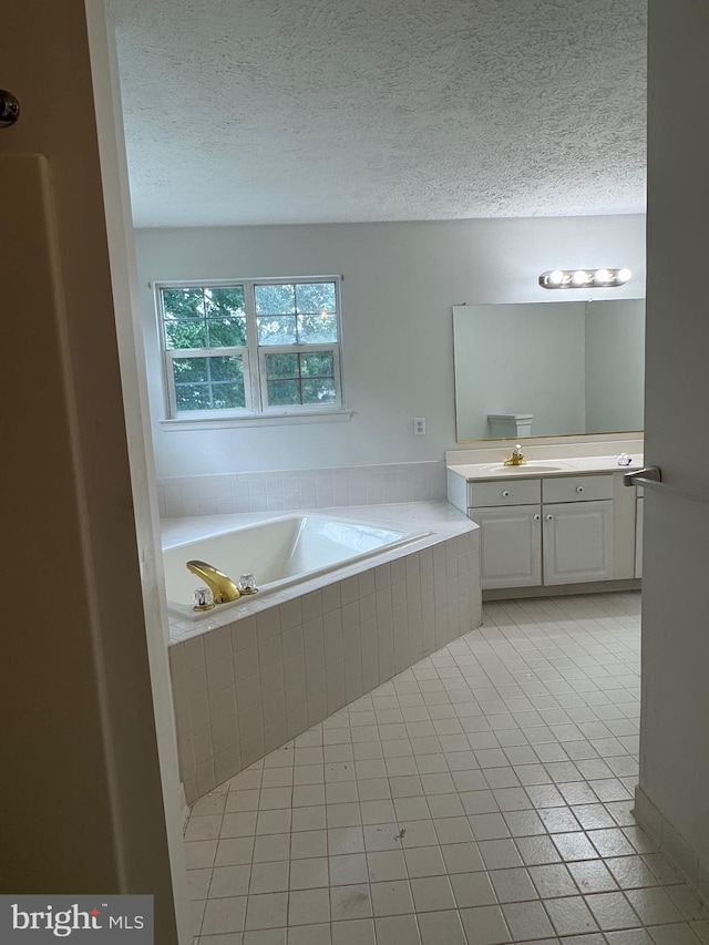 1809 Labrott Ln, Annapolis, MD 21401 - full bathroom featuring vanity, a bath, tile patterned flooring, and a textured ceiling