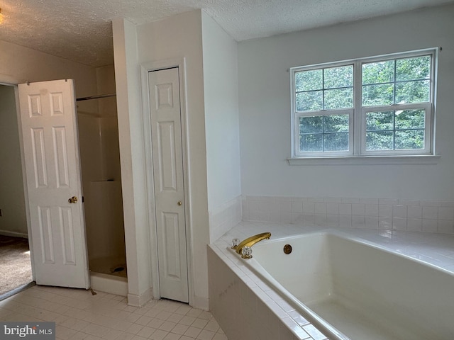 1809 Labrott Ln, Annapolis, MD 21401 - full bathroom with a closet, a textured ceiling, a bath, and tile patterned floors