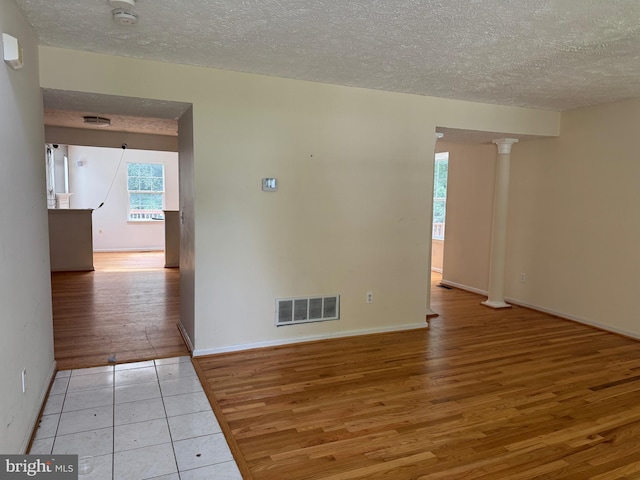 1809 Labrott Ln, Annapolis, MD 21401 - empty room featuring a smoke detector, light wood-type flooring, and a textured ceiling