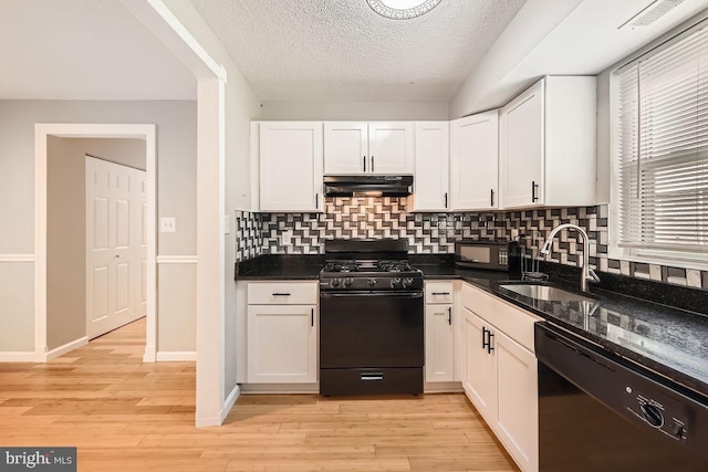 11921 Tarragon Rd Unit F, Reisterstown, MD 21136 - kitchen featuring black appliances, under cabinet range hood, white cabinets, backsplash, and light wood-type flooring