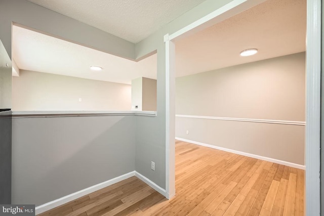 11921 Tarragon Rd Unit F, Reisterstown, MD 21136 - hall featuring wood finished floors, a textured ceiling, and recessed lighting