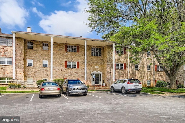 11921 Tarragon Rd Unit F, Reisterstown, MD 21136 - view of building exterior featuring uncovered parking