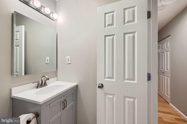 11921 Tarragon Rd Unit F, Reisterstown, MD 21136 - bathroom featuring vanity and wood finished floors