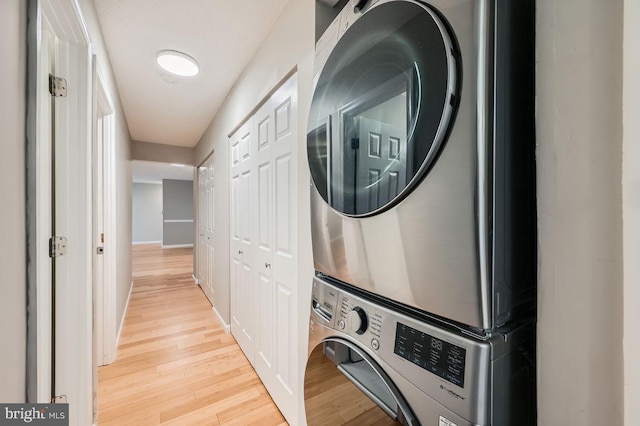11921 Tarragon Rd Unit F, Reisterstown, MD 21136 - washroom with estacked washer and dryer and light wood finished floors