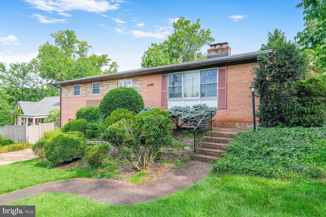 4901 Ashby St NW, Washington, DC 20007 - view of front facade featuring a chimney and brick siding