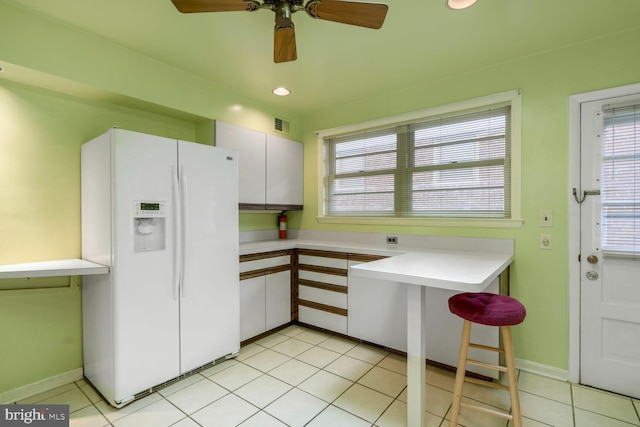 4901 Ashby St NW, Washington, DC 20007 - kitchen featuring white refrigerator with ice dispenser, light countertops, plenty of natural light, and ceiling fan
