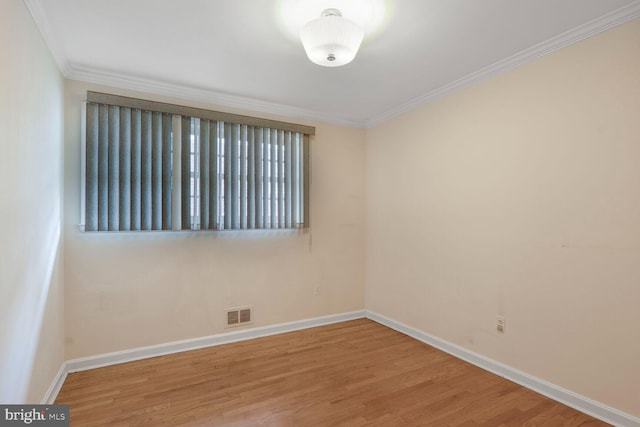 4901 Ashby St NW, Washington, DC 20007 - empty room featuring wood finished floors and ornamental molding