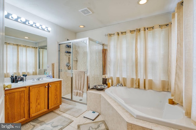 13663 Harvest Glen Way, Germantown, MD 20874 - bathroom with a garden tub, a stall shower, vanity, tile patterned floors, and recessed lighting