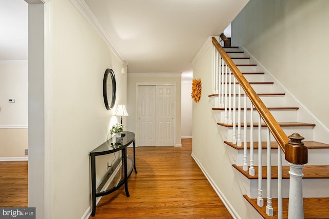 707 Pheasant Run, Kennett Square, PA 19348 - corridor with stairway, wood finished floors, and ornamental molding