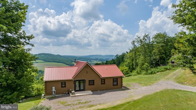 322 Devils Half Acre Rd, Accident, MD 21520 - back of property featuring log exterior, a lawn, a metal roof, a mountain view, and driveway