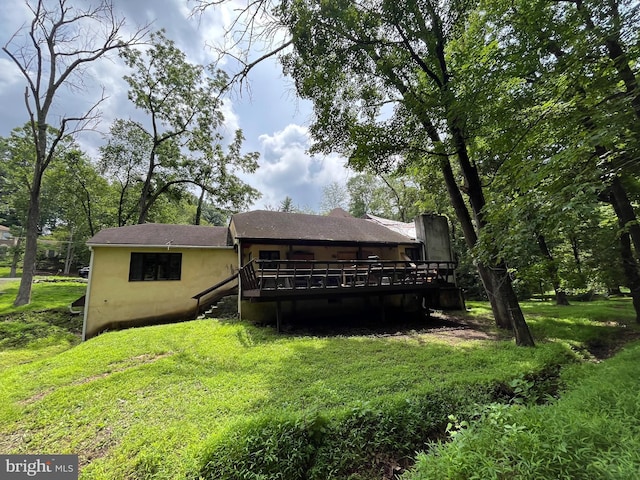 93 Jacobs Creek Rd, Ewing, NJ 08628 - back of property with a deck, a lawn, and stucco siding