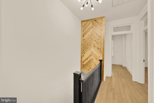1371 Perry Pl NW, Washington, DC 20010 - hallway with an upstairs landing, a chandelier, and light wood-style floors