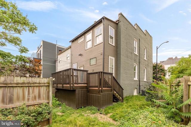 1371 Perry Pl NW, Washington, DC 20010 - rear view of property with stairs and a wooden deck