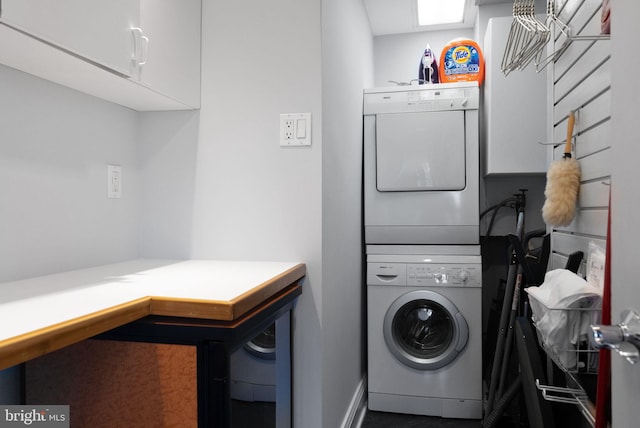 2230 California St NW Unit 5Cw, Washington, DC 20008 - washroom with stacked washer / drying machine and cabinet space