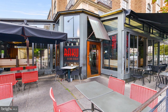 2230 California St NW Unit 5Cw, Washington, DC 20008 - view of exterior entry with brick siding and a patio