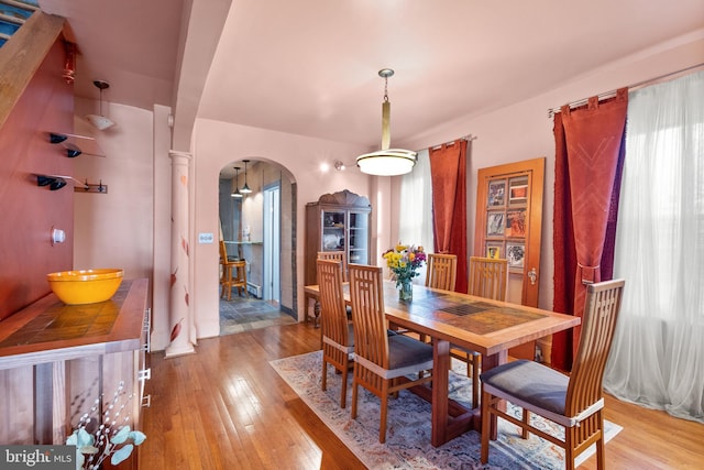 2515 17th St NE, Washington, DC 20018 - dining space featuring arched walkways and light wood-style floors