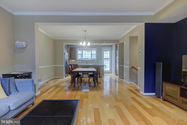 2046 Blunt Ln, Alexandria, VA 22303 - dining area with light wood-style floors, a chandelier, and crown molding