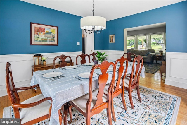 8 High Acres Dr, Ewing, NJ 08628 - dining space with wainscoting, a chandelier, light wood-style floors, and a decorative wall