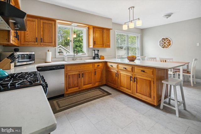 8 High Acres Dr, Ewing, NJ 08628 - kitchen with exhaust hood, appliances with stainless steel finishes, light countertops, and brown cabinets