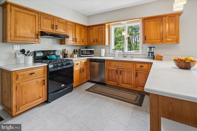 8 High Acres Dr, Ewing, NJ 08628 - kitchen featuring appliances with stainless steel finishes, under cabinet range hood, brown cabinetry, and light countertops