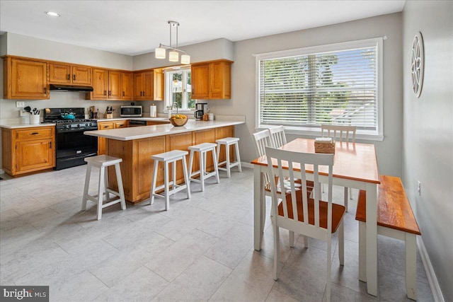 8 High Acres Dr, Ewing, NJ 08628 - kitchen with gas stove, light countertops, a kitchen breakfast bar, a peninsula, and brown cabinets