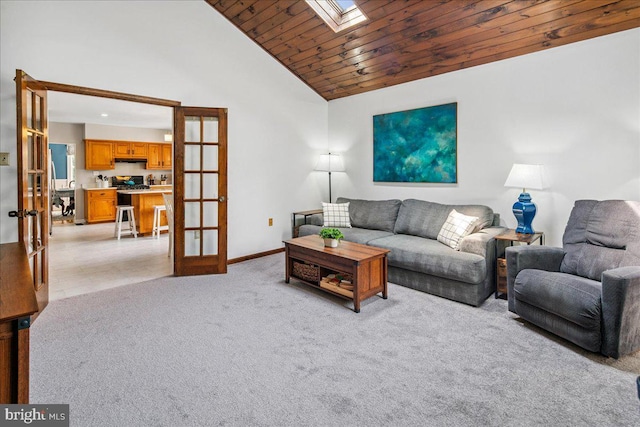 8 High Acres Dr, Ewing, NJ 08628 - living area with french doors, a skylight, vaulted ceiling, light colored carpet, and wood ceiling