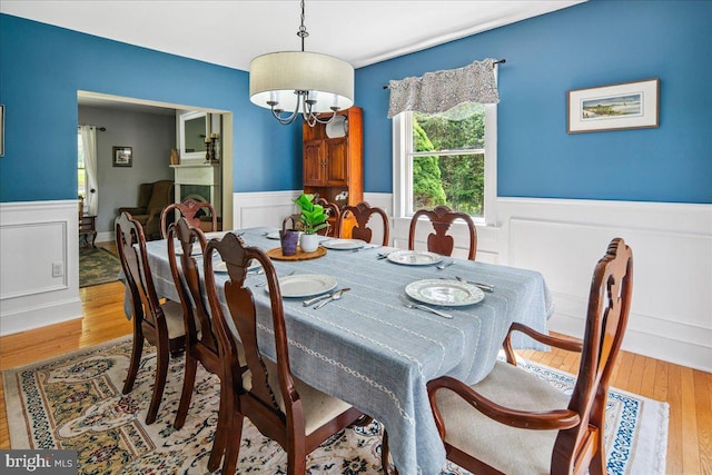 8 High Acres Dr, Ewing, NJ 08628 - dining space featuring wainscoting, wood finished floors, and a chandelier