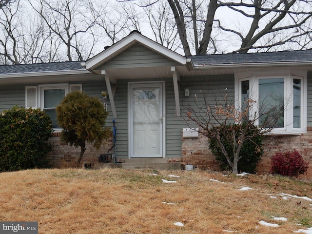 129 Lastner Ln, Greenbelt, MD 20770 - doorway to property featuring brick siding