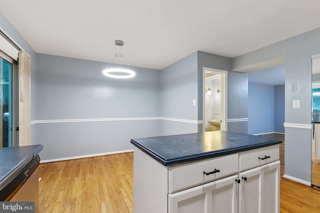 4 Habersham Ct, Silver Spring, MD 20906 - kitchen featuring dark countertops, light wood-style floors, and white cabinetry