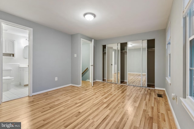 4 Habersham Ct, Silver Spring, MD 20906 - unfurnished bedroom featuring wood finished floors, ensuite bath, and a closet